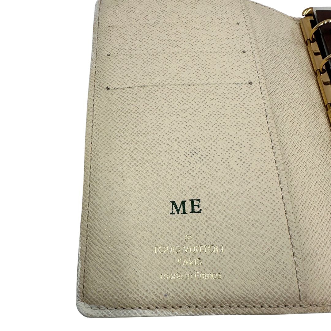 Porta agenda Louis Vuitton in tela monogram; chiusura a bottone in metallo dorato