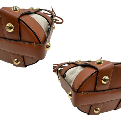 Angoli Borsa a secchiello Salvatore Ferragamo in pelle marrone cognac con sacca interna in tela beige con chiusura a coulisse. Munita di un manico stondato e tracolla, parti metalliche dorate. Completa di dustbag. Originale, usato, in condizioni ottime. 