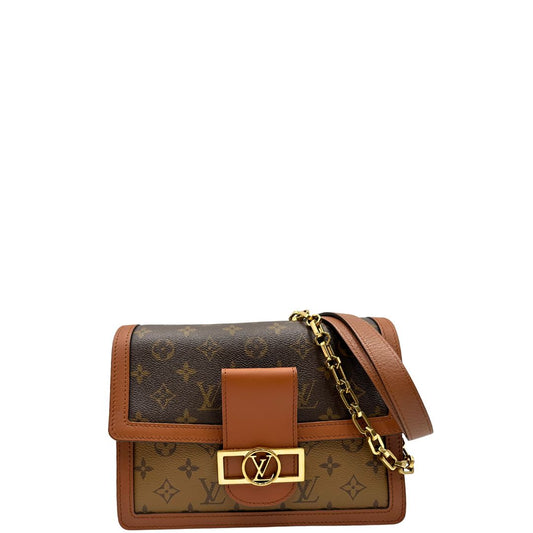 front Borsa Dauphine MM Louis Vuitton in tela monogram e monogram reverse bicolore con finiture in pelle cognac e parti metalliche dorate. Completa di scatola, di lusso, originale, ottime condizioni. 