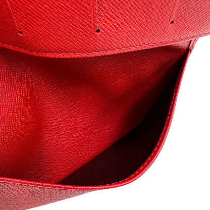Portacarte Louis Vuitton in pelle Epi rossa; completo di dustbag, di lusso, originale, usato.