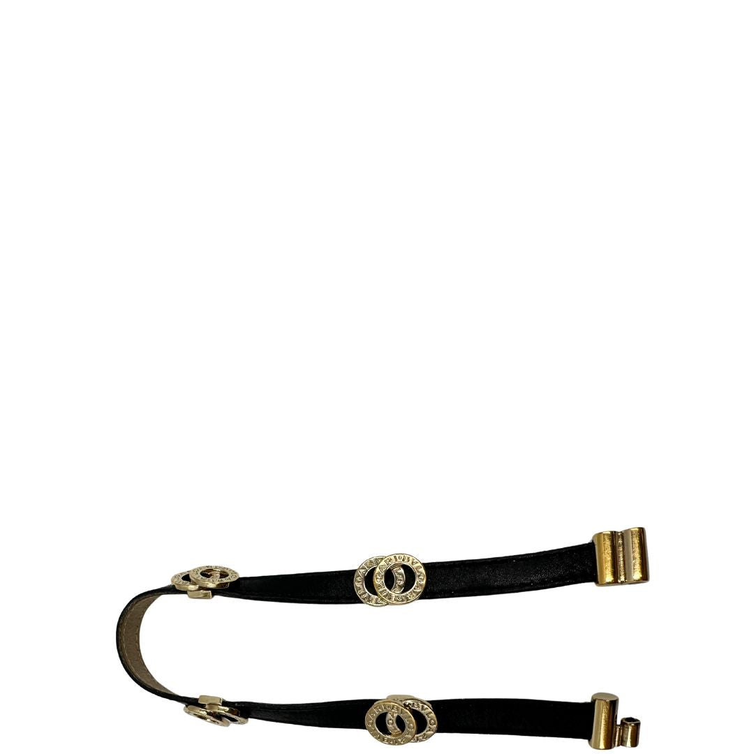 Bracciale Bulgari in pelle nero a doppio giro, con charm in metallo dorati. Completo di scatola logata.
