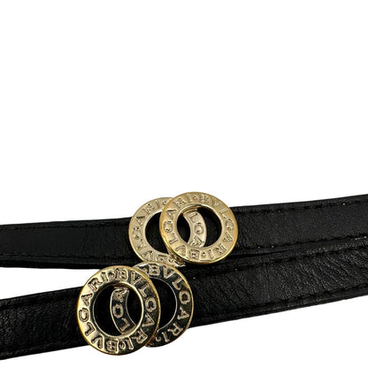 Bracciale Bulgari in pelle nero a doppio giro, con charm in metallo dorati. Completo di scatola logata.