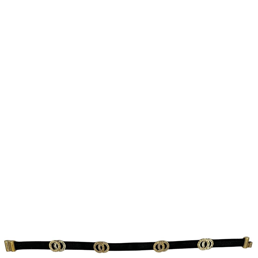 Bracciale Bulgari in pelle nero a doppio giro, con charm in metallo dorati. Completo di scatola logata.