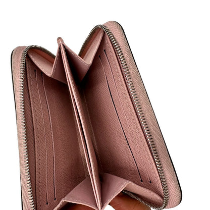 Portafoglio Louis Vuitton Epi rosa con parti metalliche argentate. Completo di scatola logata, di lusso, originale, ottime condizioni.