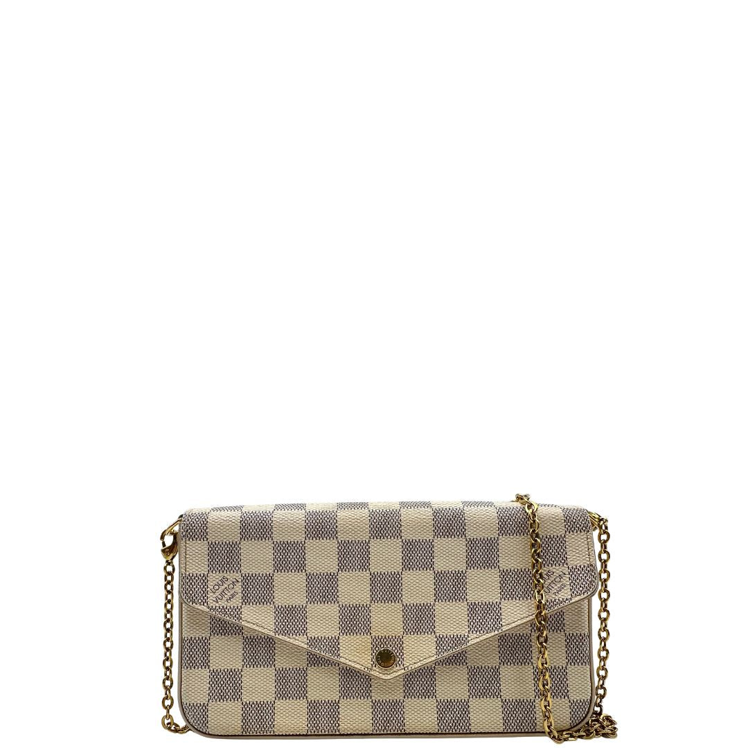 Borsa Louis Vuitton Félicie in canvas Damier Azur con parti metalliche dorate e interno in pelle rosa. Munita di una tracolla in catena amovibile e accessori portacarte, e portamonete estraibili. Originale, usato, in condizioni ottime.
