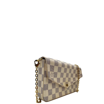 Borsa Louis Vuitton Félicie in canvas Damier Azur con parti metalliche dorate e interno in pelle rosa. Munita di una tracolla in catena amovibile e accessori portacarte, e portamonete estraibili. Originale, usato, in condizioni ottime.