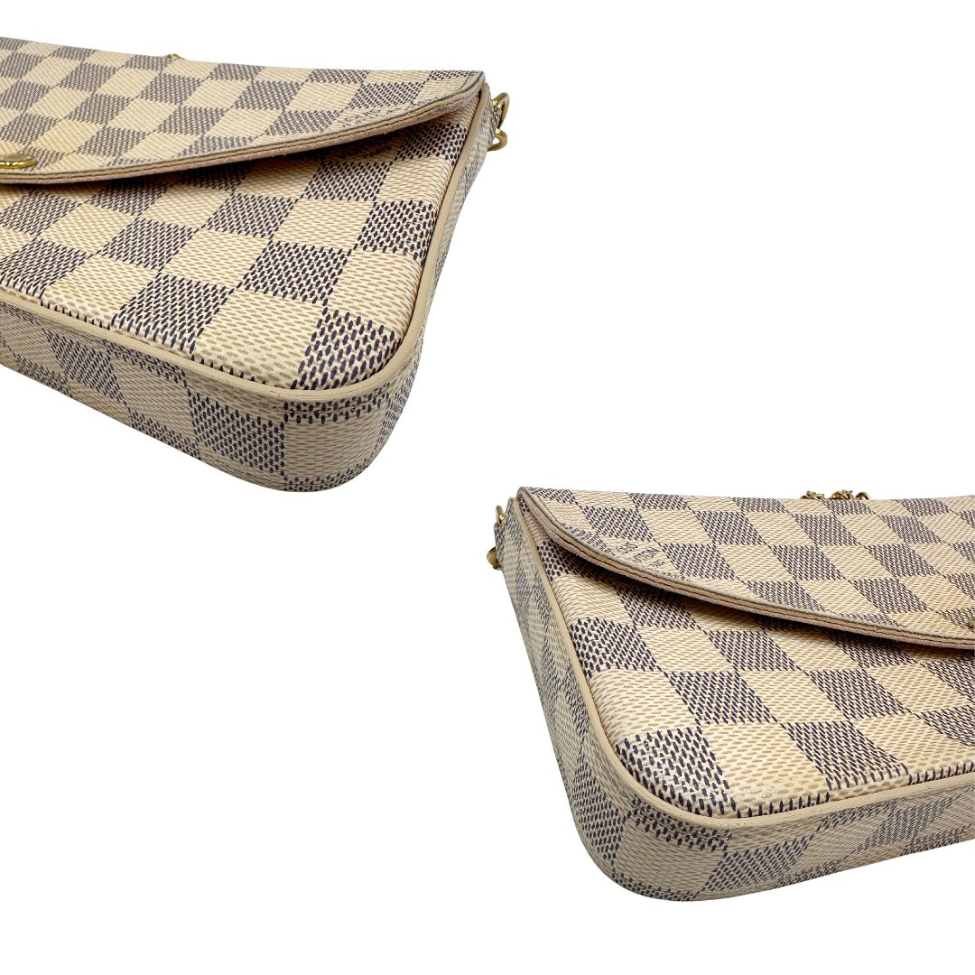 Borsa Louis Vuitton Félicie in canvas Damier Azur con parti metalliche dorate e interno in pelle rosa. Munita di una tracolla in catena amovibile e accessori portacarte, e portamonete estraibili. Originale, usato, in condizioni ottime.