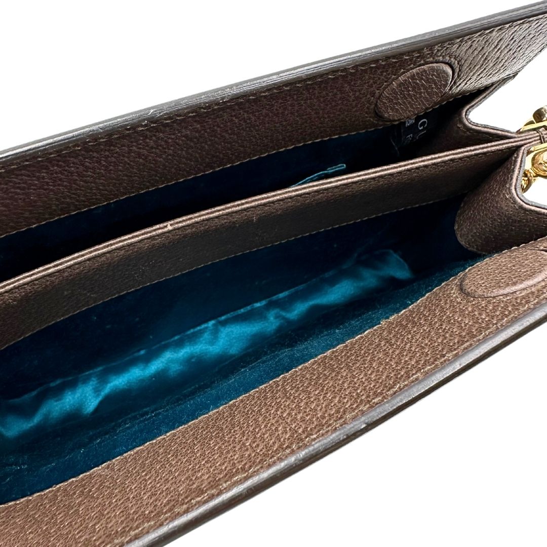 interno Borsa Gucci Ophidia in canvas beige GG con finiture in pelle marrone, striscia Web in tessuto verde e rosso, con parti metalliche dorate. Dotata di una tracolla in catena, di lusso, originale, ottime condizioni.