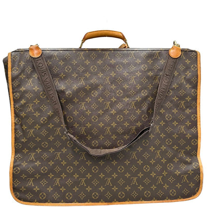 retro Borsa da viaggio in canvas marrone monogram con finiture in vacchetta naturale e parti metalliche dorate; munita di un manico singolo,una tracolla amovibile e regolabile e 5 grucce, di lusso, originale, ottime condizioni. 