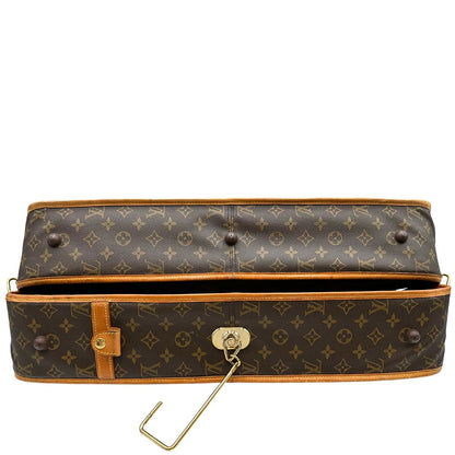 base Borsa da viaggio in canvas marrone monogram con finiture in vacchetta naturale e parti metalliche dorate; munita di un manico singolo,una tracolla amovibile e regolabile e 5 grucce, di lusso, originale, ottime condizioni. 