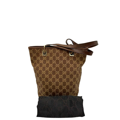 Borsa Gucci Tote in tessuto marrone GG con finiture in pelle tono su tono e parti metalliche dorate. Completa di dustbag. Originale, usato, in condizioni ottime. 