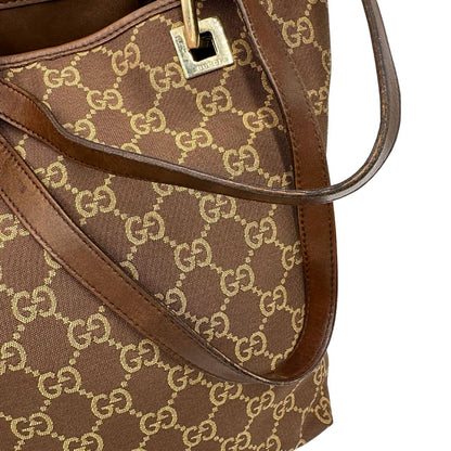 Borsa Gucci Tote in tessuto marrone GG con finiture in pelle tono su tono e parti metalliche dorate. Completa di dustbag. Originale, usato, in condizioni ottime. 
