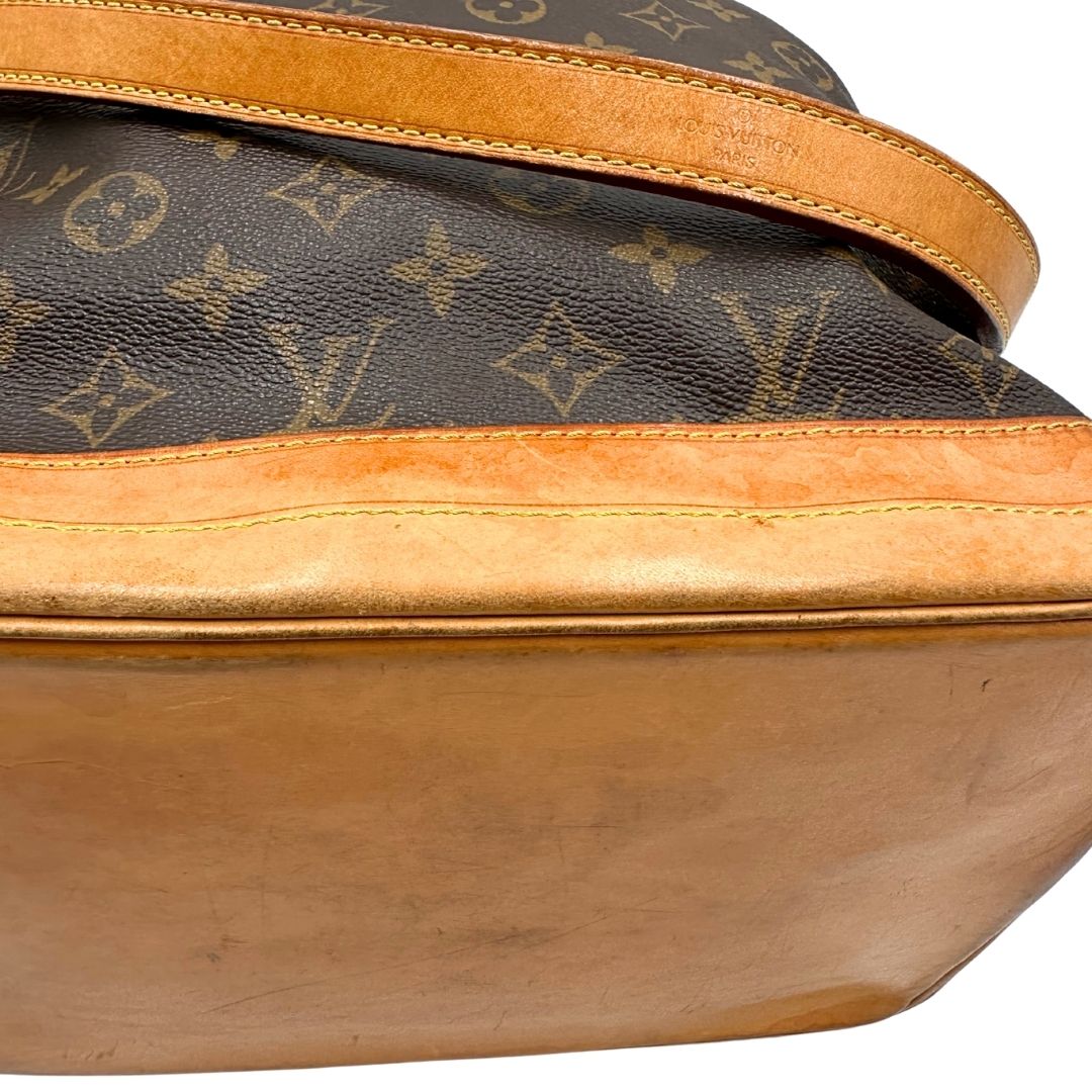 base Secchiello Noé Louis Vuitton in canvas marrone monogram con finiture in vacchetta naturale, tracolla regolabile con fibbia e parti metalliche dorate. Completo di corredo, di lusso, originale, ottime condizioni. 