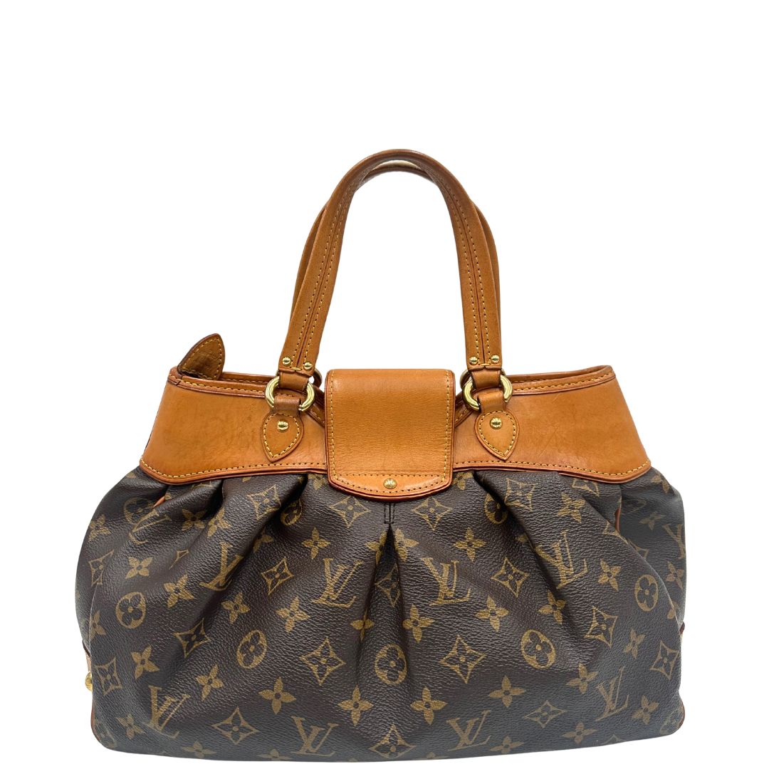 Retro di una borsa Louis Vuitton in canvas marrone monogram con finiture in vacchetta naturale e parti metalliche dorate; munita di doppi manici stondati, da indossare a mano.
