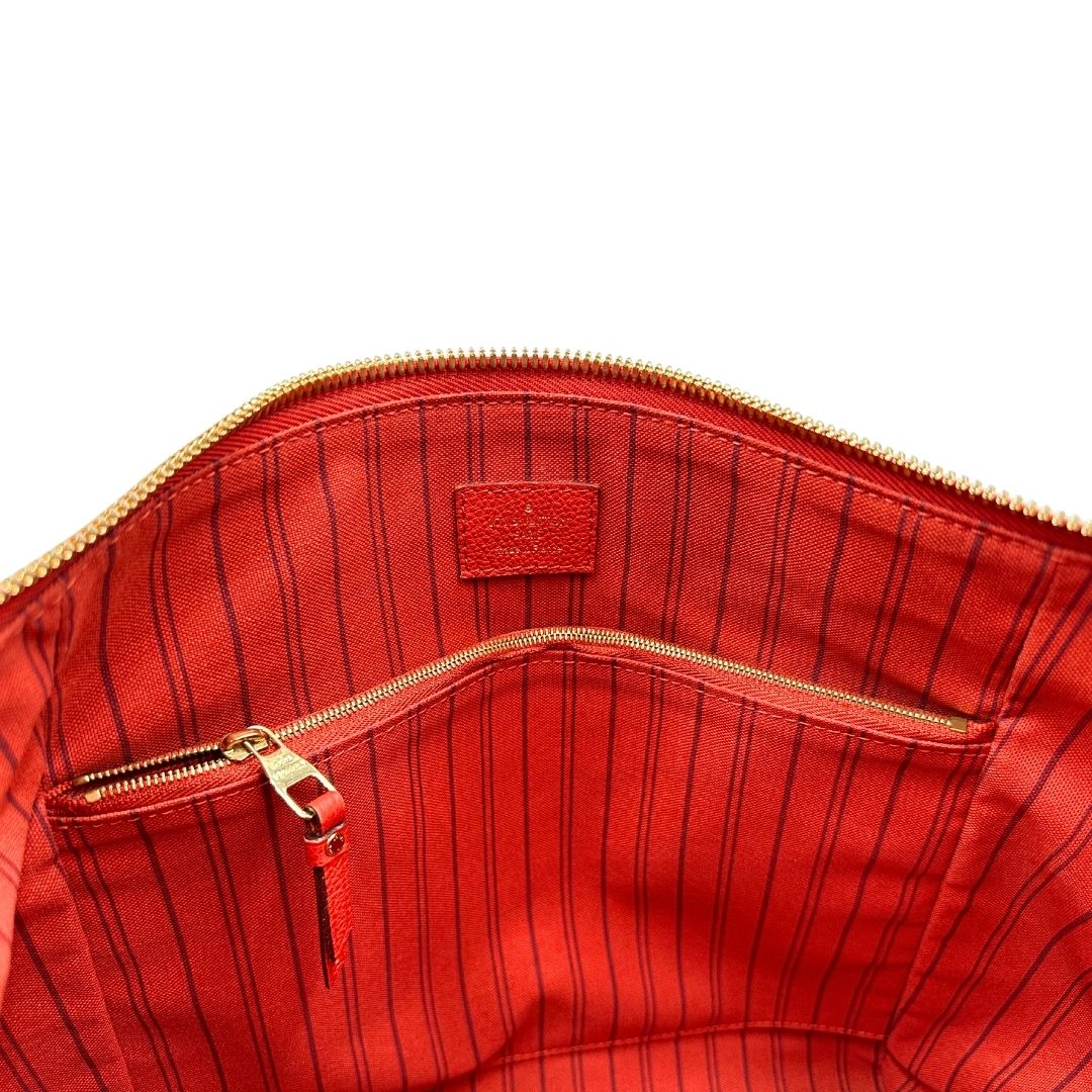 interno Borsa Louis Vuitton pelle color rosso aranciato monogram Empreinte con parti metalliche dorate; munita di doppi manici e una tracolla amovibile e regolabile. Completa di lucchetto e chiavi, di lusso, originale, ottime condizioni.  
