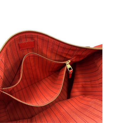 interno Borsa Louis Vuitton pelle color rosso aranciato monogram Empreinte con parti metalliche dorate; munita di doppi manici e una tracolla amovibile e regolabile. Completa di lucchetto e chiavi, di lusso, originale, ottime condizioni.  