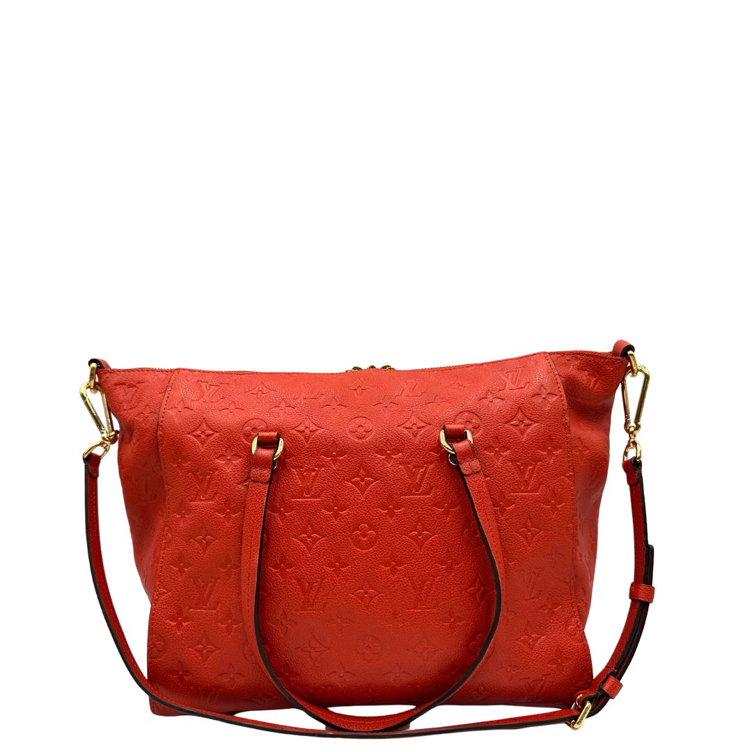 retro Borsa Louis Vuitton pelle color rosso aranciato monogram Empreinte con parti metalliche dorate; munita di doppi manici e una tracolla amovibile e regolabile. Completa di lucchetto e chiavi, di lusso, originale, ottime condizioni. 