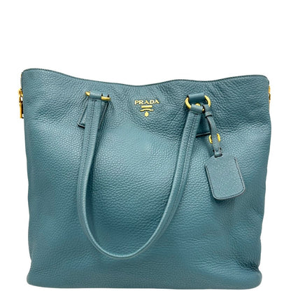 front Borsa Tote Prada in pelle martellata color teal con parti metalliche dorate; munita di doppi manici, indossabile a spalla. Completa di dustbag, di lusso, originale, usata. 
