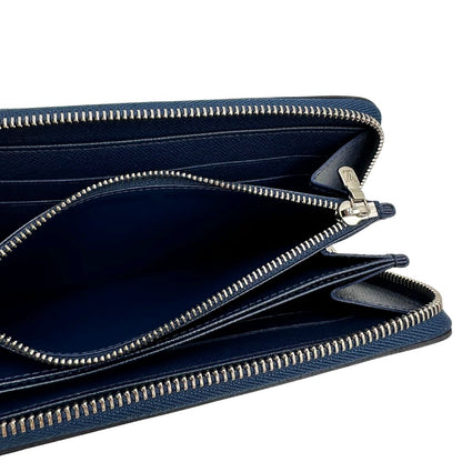 Interno di un portafoglio Louis Vuitton in pelle Epi blu marino con parti metalliche argentate. Completo di corredo.