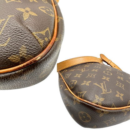 angoli Borsa Odeon PM Louis Vuitton in canvas marrone monogram con finiture in vacchetta naturale e parti metalliche dorate. Dotata di tracolla regolabile con fibbia, di lusso, originale, buone condizioni, usata.