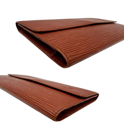 Portafoglio Gucci in pelle Epi color cognac con parti metalliche dorate. Completo di dustbag, di lusso, originale, ottime condizioni.