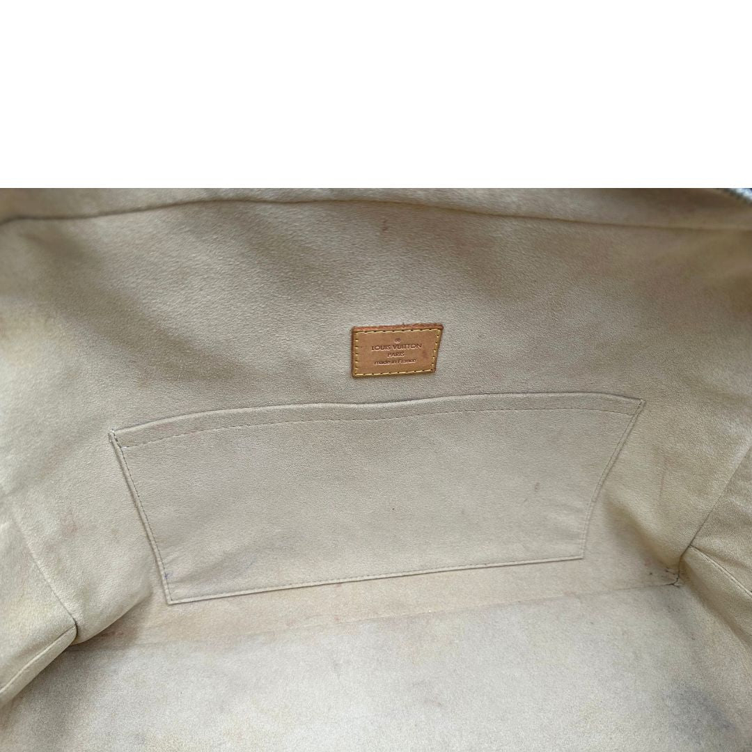 Interno di una Borsa Louis Vuitton in canvas marrone monogram con finiture in vacchetta naturale e parti metalliche dorate; munita di doppi manici. Indossabile a mano. Originale, usata, di lusso in ottime condizioni
