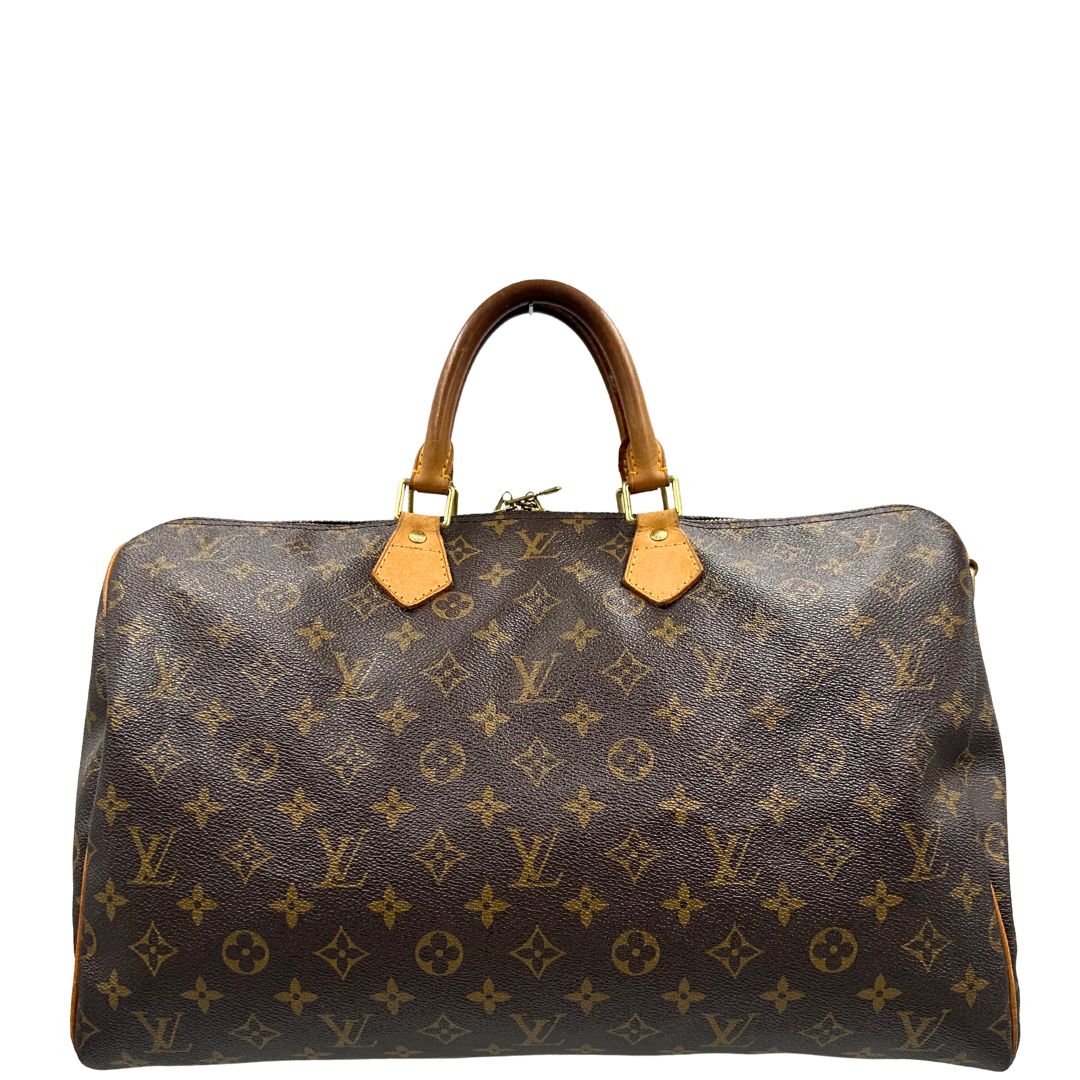 front Borsa Louis Vuitton in canvas marrone monogram con finiture in vacchetta naturale e parti metalliche dorate; munita di doppi manici stondati. Completa di dustbag, lucchetto e chiave. 