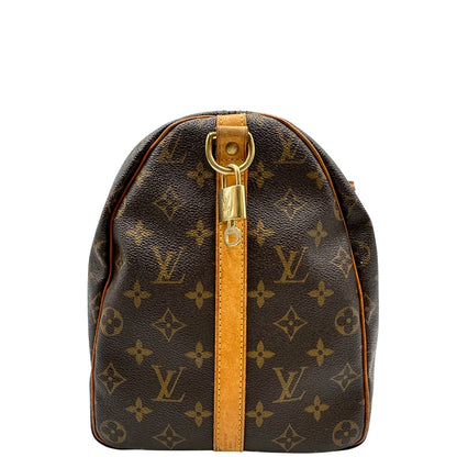 laterale della Borsa Louis Vuitton in canvas marrone monogram con finiture in vacchetta naturale e parti metalliche dorate; munita di doppi manici stondati. Completa di dustbag, lucchetto e chiave.