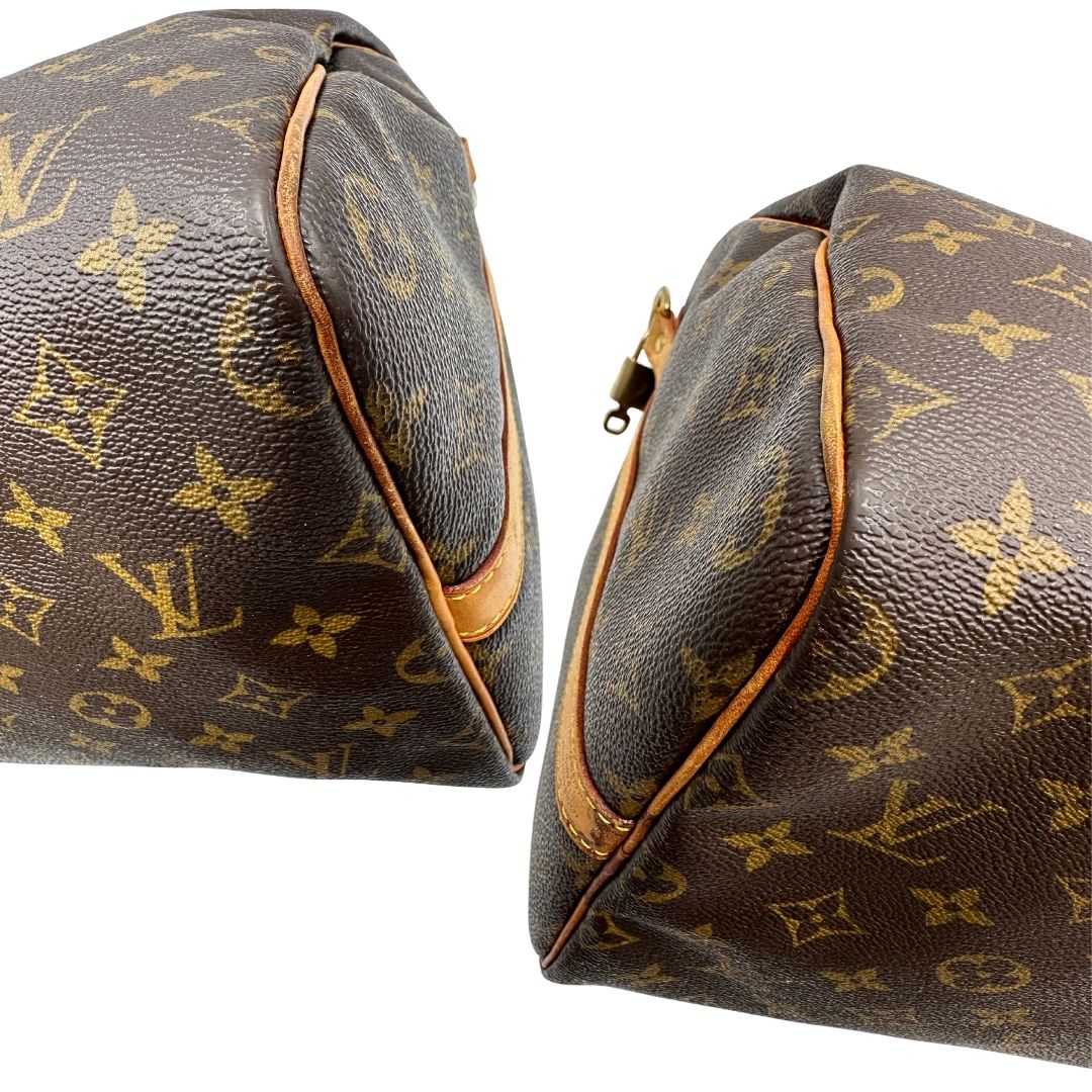 angoli Borsa Louis Vuitton in canvas marrone monogram con finiture in vacchetta naturale e parti metalliche dorate; munita di doppi manici stondati. Completa di dustbag, lucchetto e chiave. 