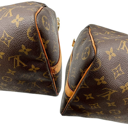 angoli Borsa Louis Vuitton in canvas marrone monogram con finiture in vacchetta naturale e parti metalliche dorate; munita di doppi manici stondati. Completa di dustbag, lucchetto e chiave. 