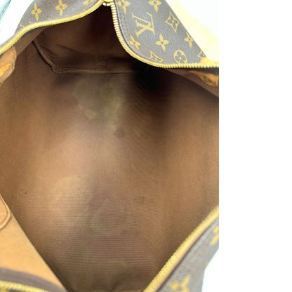 interno con aloni Borsa Louis Vuitton in canvas marrone monogram con finiture in vacchetta naturale e parti metalliche dorate; munita di doppi manici stondati. Completa di dustbag, lucchetto e chiave. 