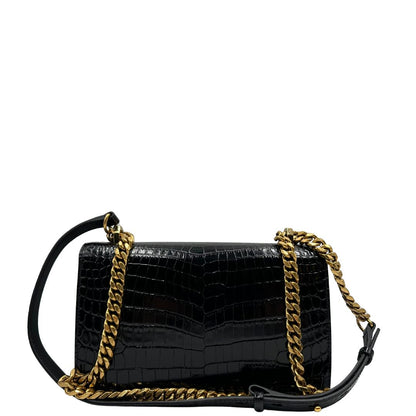 retro Borsa Alexander McQueen in pelle cocco nera con parti metalliche dorate; munita di una tracolla scorrevole in catena con spallaccio in pelle e una knuckle handle impreziosita da teschi e diamanti incastonati. Completa di dustbag, di lusso, originale, eccellenti condizioni 