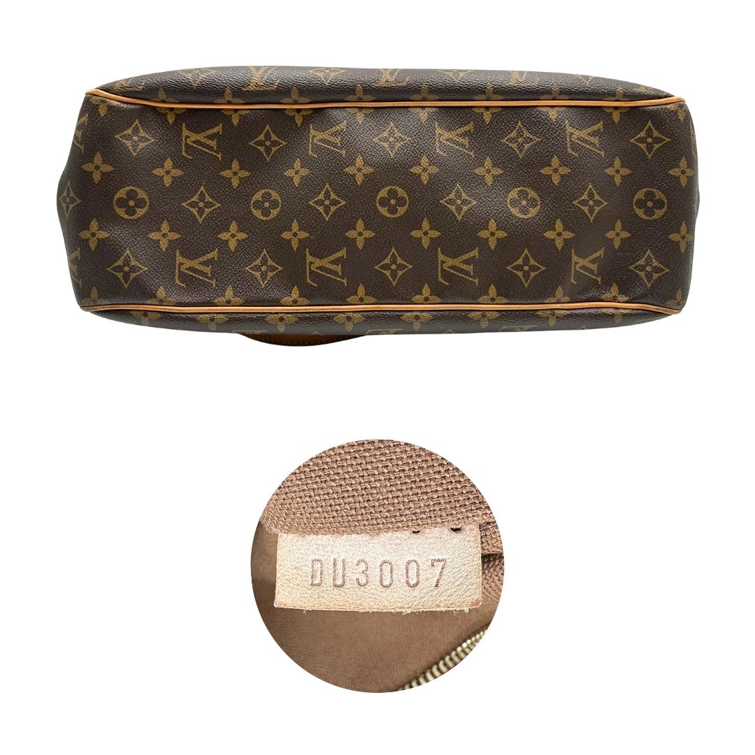 Base e codice di una borsa LV in canvas marrone monogram con finiture in vacchetta naturale e dettagli metallici dorati. Dotata di dustbag.