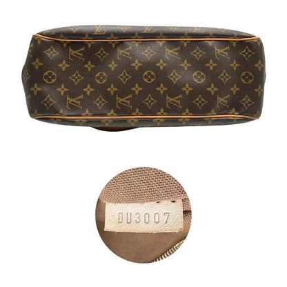 Base e codice di una borsa LV in canvas marrone monogram con finiture in vacchetta naturale e dettagli metallici dorati. Dotata di dustbag.