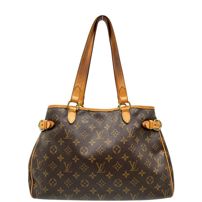 Front di una borsa LV in canvas marrone monogram con finiture in vacchetta naturale e dettagli metallici dorati. Dotata di dustbag.