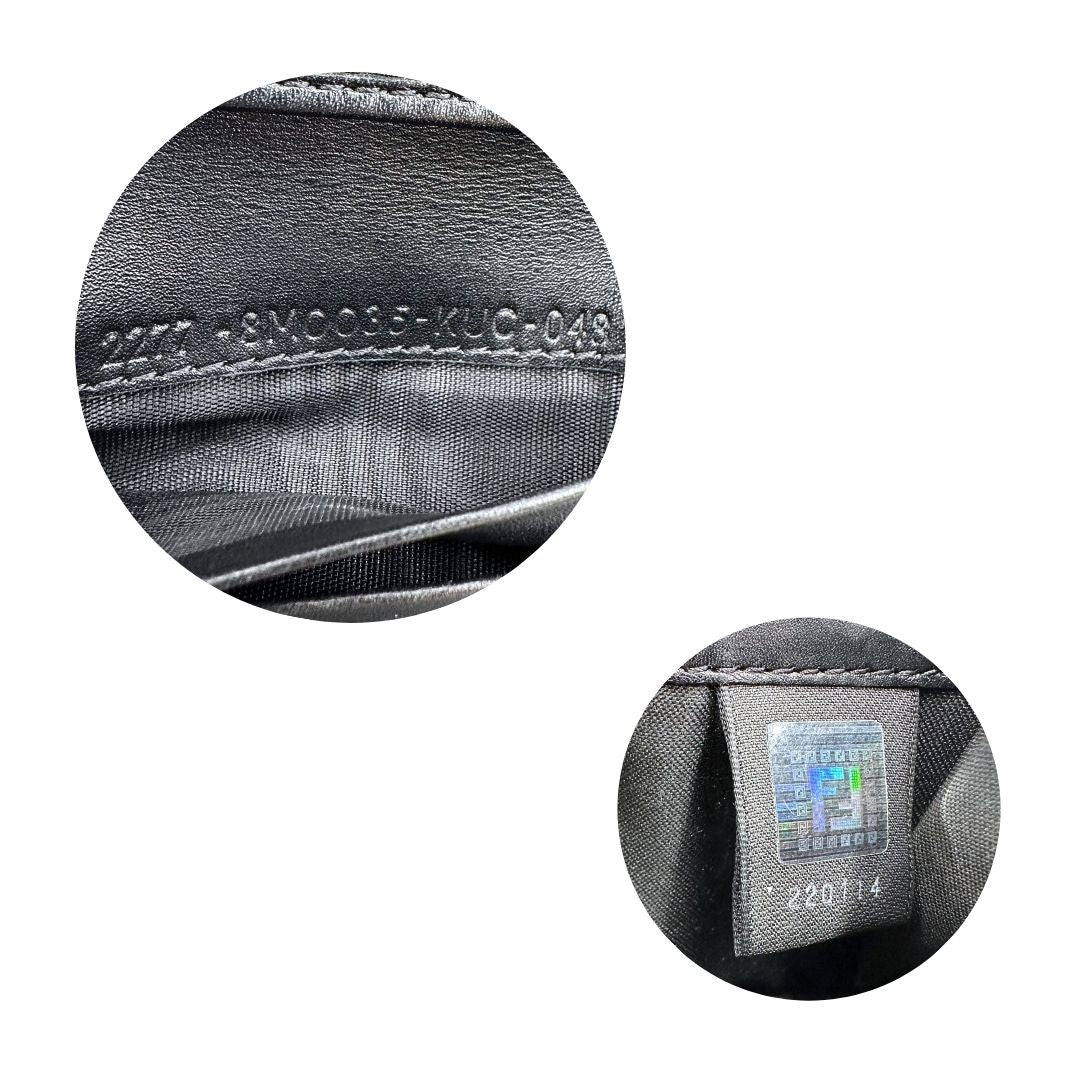 Codici di un portafoglio Fendi in pelle nera con logo doppie F sul front e con parti metalliche argentate.