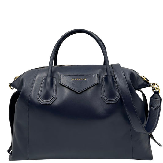 Front di una Borsa Givenchy Antigona in pelle blu notte munita di doppi manici stondati, Parti metalliche dorate e una tracolla amovibile. Completa di dustbag. Originale, usata, di lusso, in ottime condizioni.