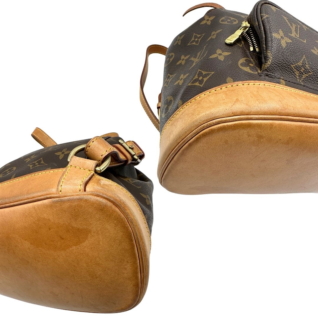 angoli Zaino Montsouris mini in canvas marrone monogram con finiture in vacchetta naturale e parti metalliche dorate, munito di un anello sulla parte superiore e due bretelle in vacchetta regolabili con fibbie. Completo di dustbag, di lusso, originale, ottime condizioni. 