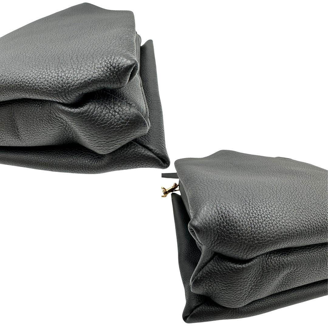 Angoli di una borsa Tod's in pelle nera martellata, con parti metalliche dorate; munita di manici stondati e di una tracolla regolabile ed amovibile. Completa di dustbag.