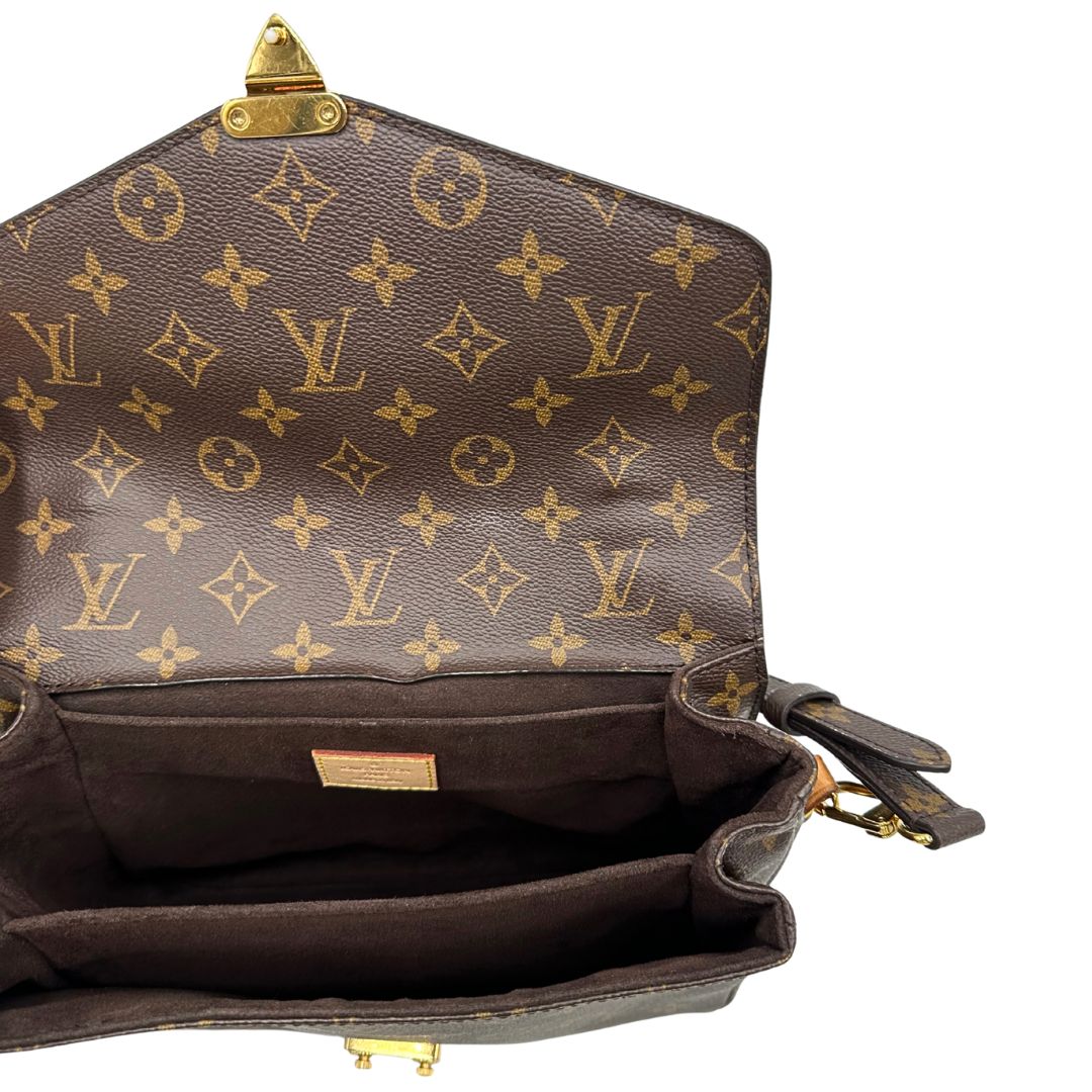 interno della  Borsa Louis Vuitton Métis in canvas marrone monogram con dettagli in vacchetta naturale e parti metalliche dorate. Munita di un manico singolo e una tracolla regolabile e amovibile. Dotato di scatola e dustbag, di lusso, originale, ottime condizioni.
