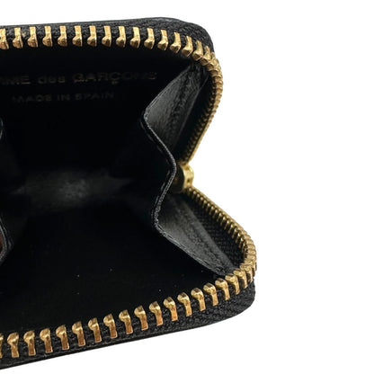 internoMini portamonete Comme des Garçon in pelle nera, con chiusura a zip dorata. Completo di scatola, di lusso, originale, ottime condizioni.