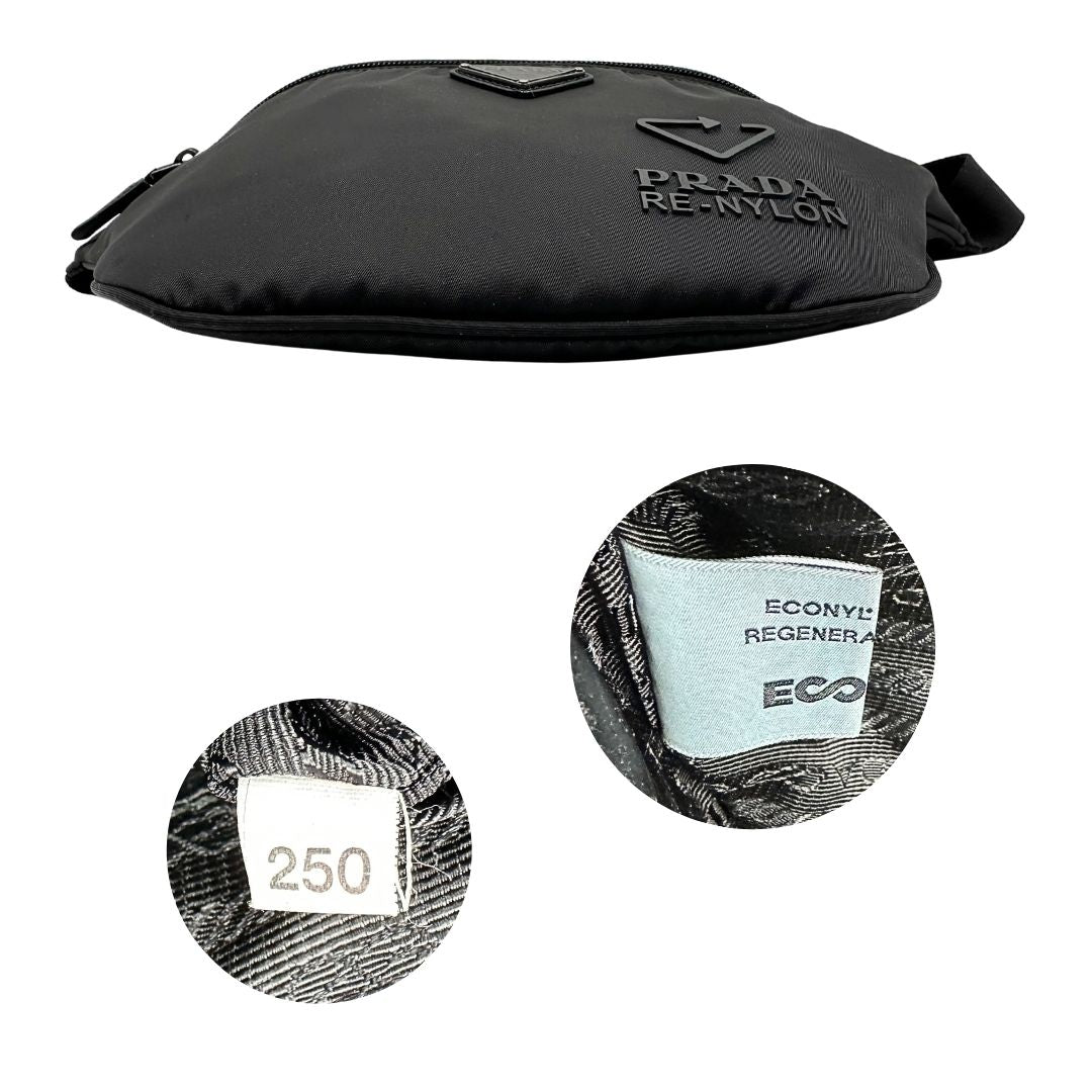 Base e codice di un marsupio Prada in Re-Nylon nero con dettagli in pelle tono su tono, logo gommato sul front e parti in metallo argentato. Leggermente regolabile, indossabile a marsupio o cross body.