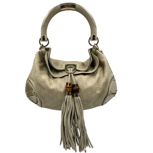front Borsa Gucci in pelle color bianco avorio GG con parti metalliche dorate; munita di un manico rigido, impreziosita da doppia nappa con dettaglio bamboo e angoli con finiture metalliche. Completa di dustbag, di lusso, originale, ottime condizioni.