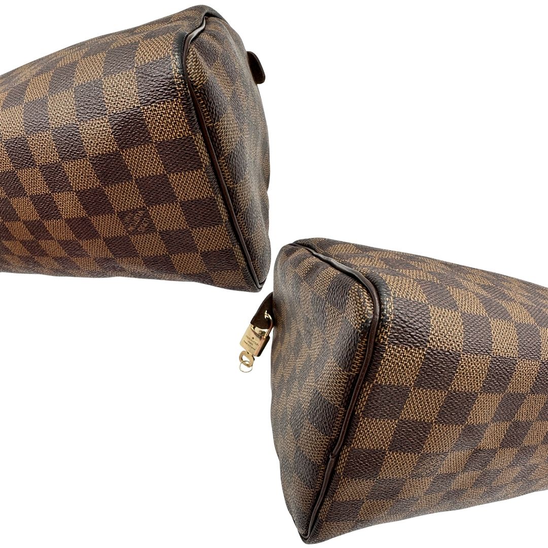 Angoli di una borsa Louis Vuitton in canvas Damier Ébène con parti metalliche dorate; munita di doppi manici stondati, da portare a mano. Completo di scatola logata, lucchetto e chiavi.