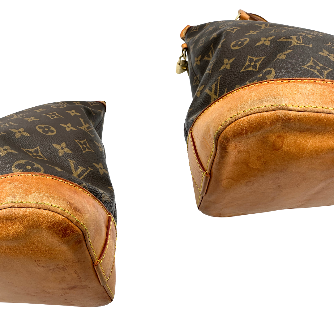Angoli di una Borsa Louis Vuitton in canvas marrone monogram con finiture in vacchetta naturale e parti metalliche dorate. Munita di doppi manici stondati. Completa di dustbag, lucchetto e chiavi. Originale, usata, di lusso, in ottime condizioni.