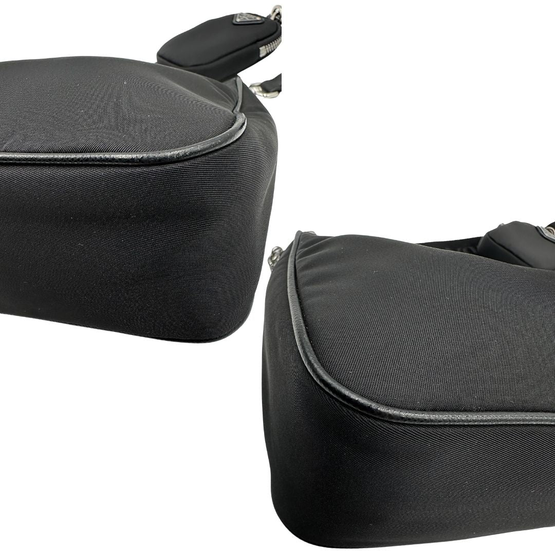 Angoli di una borsa Prada in nylon nero con parti metalliche argentate e finiture in pelle tono su tono; munita di una mini pouch amovibile, un accessorio portachiavi, manico in catena e una tracolla in tessuto amovibile e regolabile.