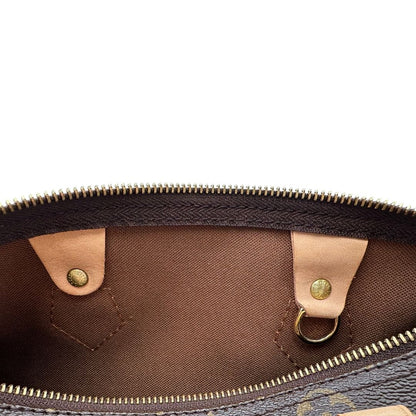 Interno di una borsa Louis Vuitton in canvas monogrammato con parti metalliche dorate; munita di doppi manici stondati, da portare a mano. Completo di scatola, dustbag, lucchetto e chiavi.