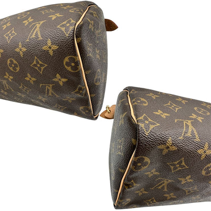 Angoli di una borsa Louis Vuitton in canvas monogrammato con parti metalliche dorate; munita di doppi manici stondati, da portare a mano. Completo di scatola, dustbag, lucchetto e chiavi.