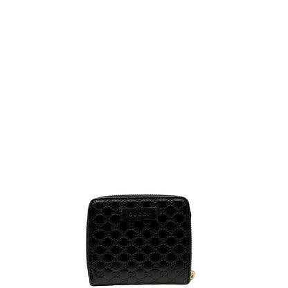 Front di un Portafoglio Gucci in pelle nera GG con parti metalliche dorate. Completo di scatola. Originale, usato, di lusso, in ottime condizioni.