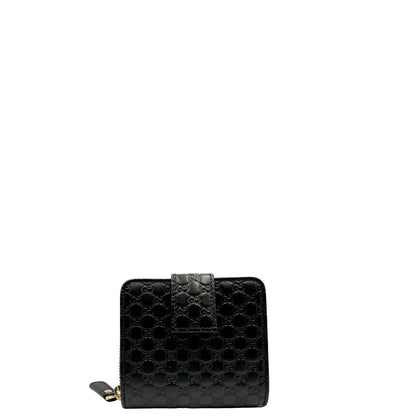 Retro di un Portafoglio Gucci in pelle nera GG con parti metalliche dorate. Completo di scatola. Originale, usato, di lusso, in ottime condizioni.